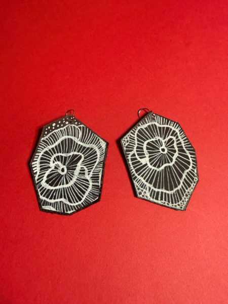 spark and rebel features upcycled black and white flower earrings in eco fashion