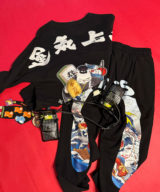 spark and rebel features upcycled preloved track pants and sweater and belt in street style eco-fashion