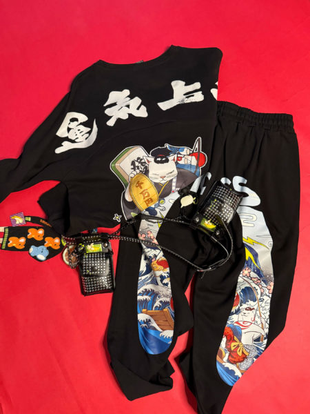 spark and rebel features upcycled preloved track pants and sweater and belt in street style eco-fashion