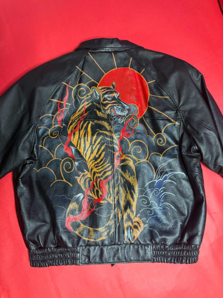 spark and rebel features upcycled tiger and red sun jacket in eco fashion