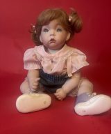spark and rebel features porcelain-style baby doll in eco fashion