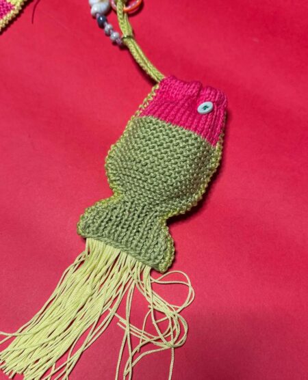 spark+rebel modular eco fashion brand handmade crochet fish airpod case in sustainable fashion on etsy